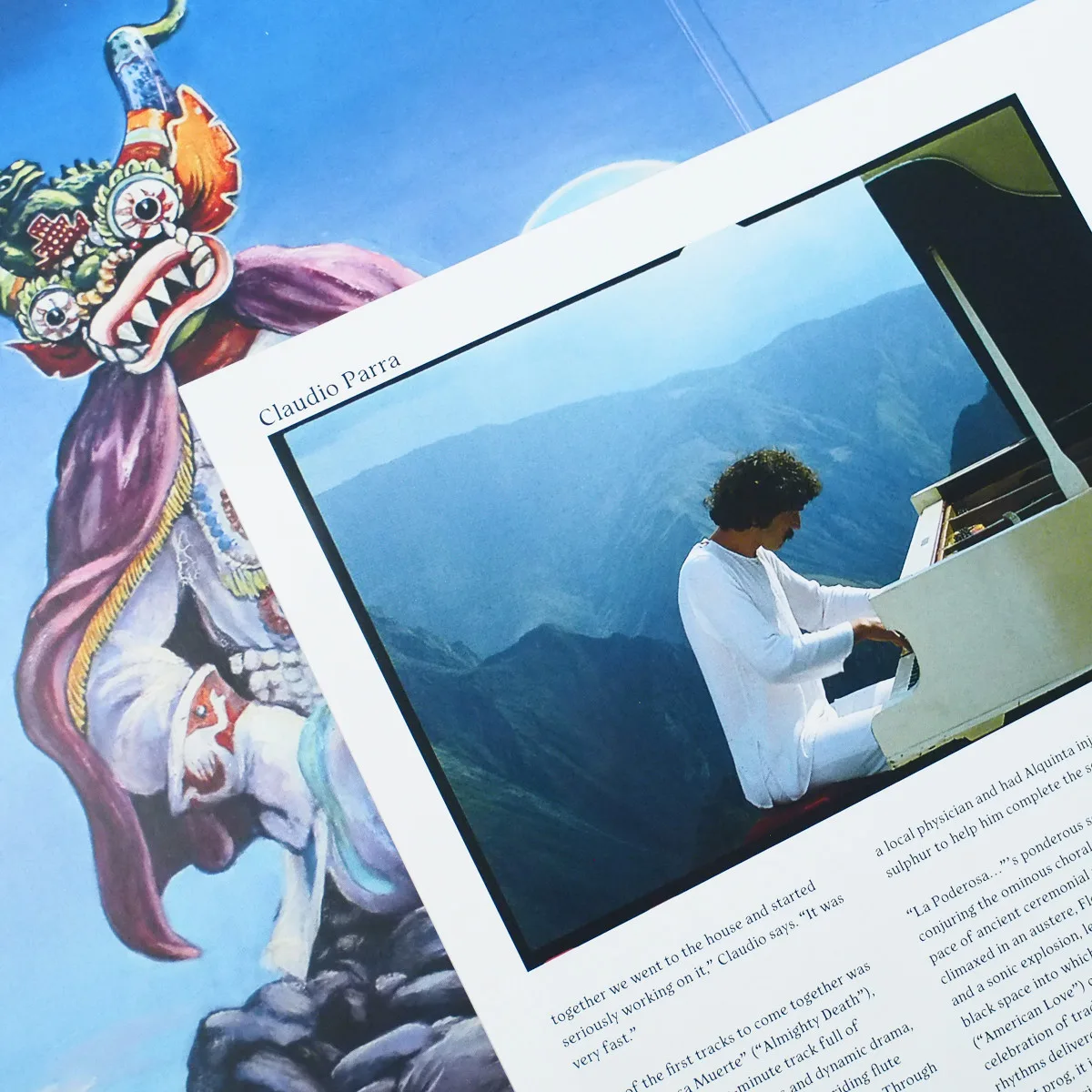 Los Jaivas Vinyl Artwork with Piano and Mountain Scene Los Jaivas vinyl artwork showing a band member playing piano outdoors against mountain scenery, with colorful painted illustrations