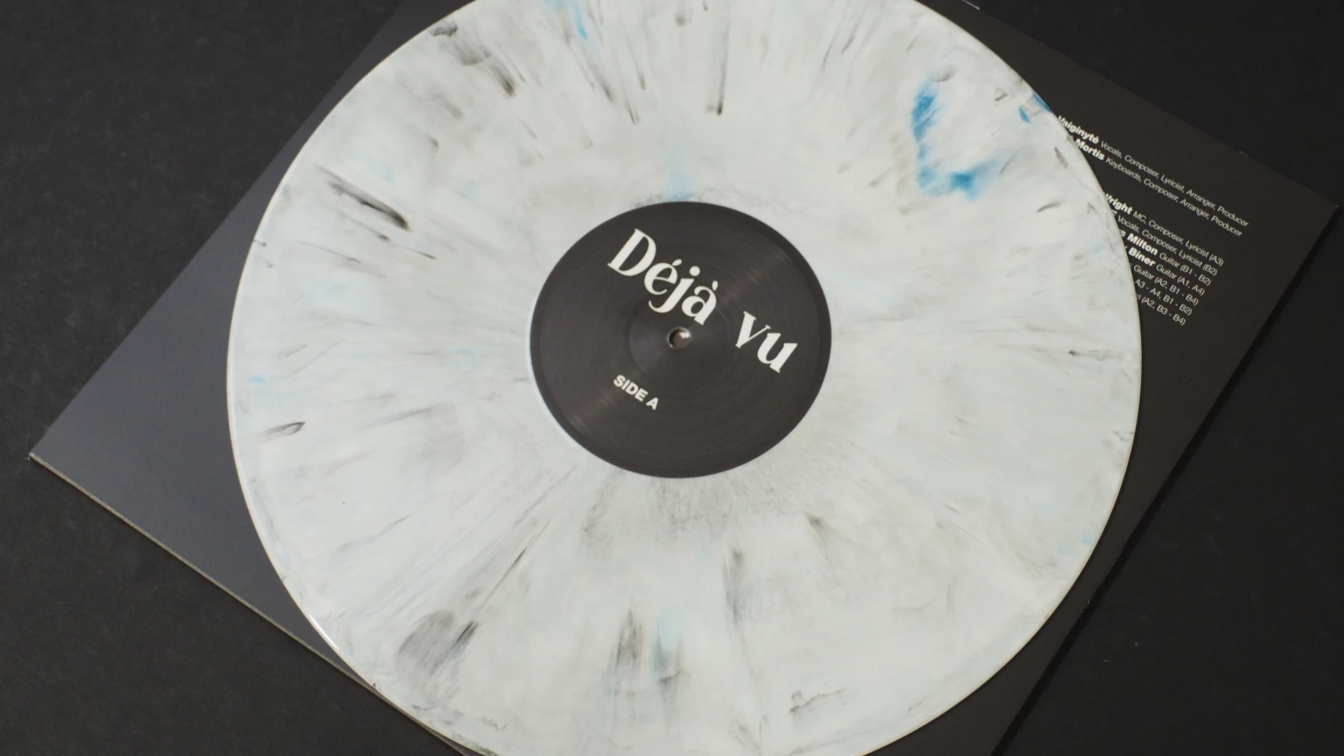 White marble vinyl record from Augustina – Déjà Vu.