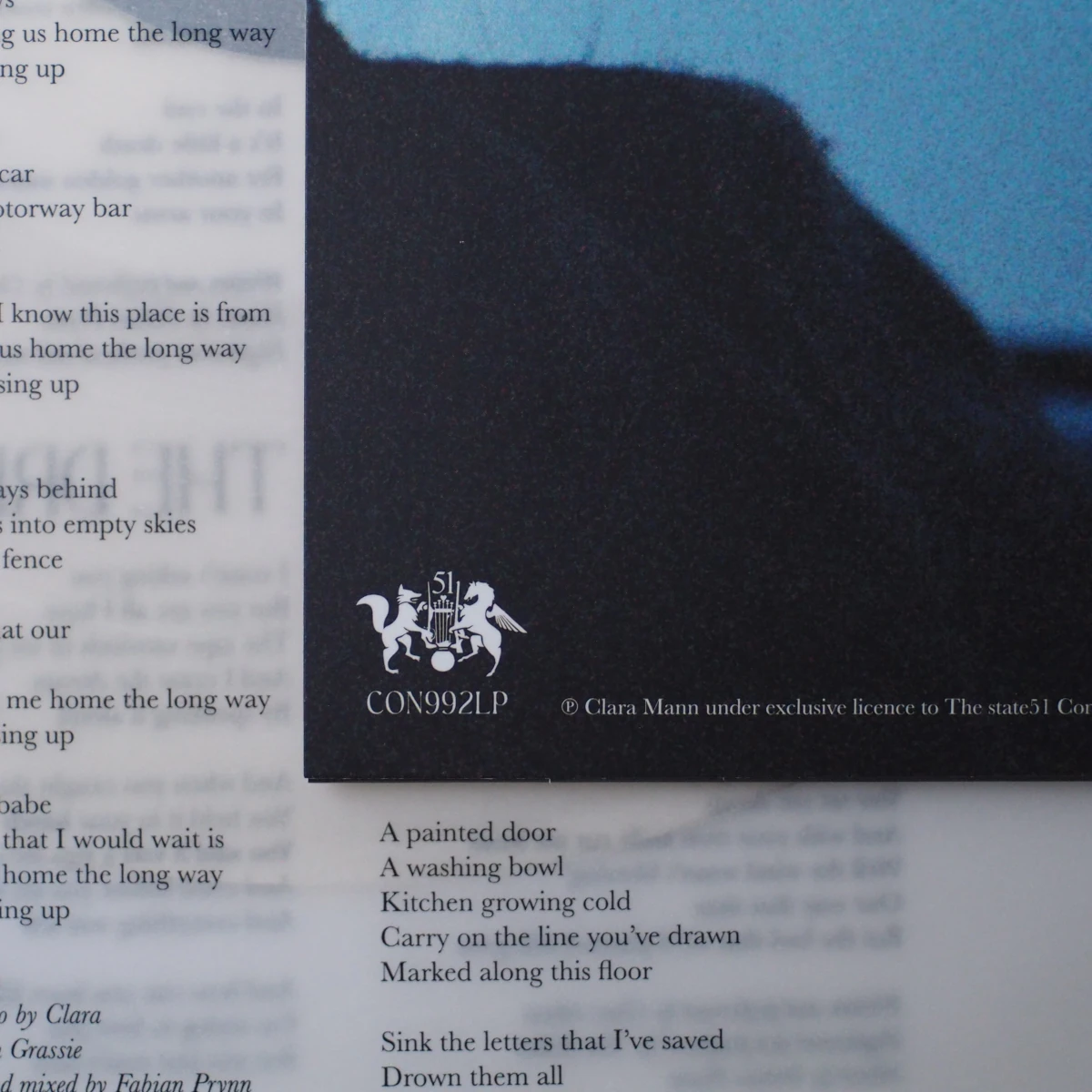 Back cover detail with CON992LP catalog number and overlaid lyrics.