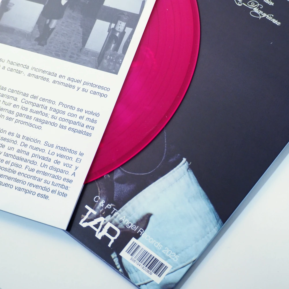 Solid pink vinyl partially pulled from the printed sleeve.