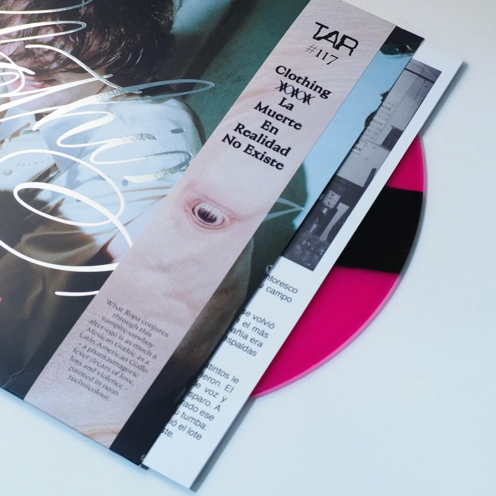 Full sleeve with artwork, OBI strip, and partially visible pink vinyl.