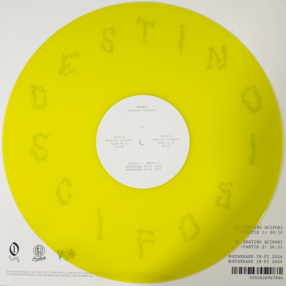 Close-up of transparent yellow vinyl with center label, showing through to the background art.