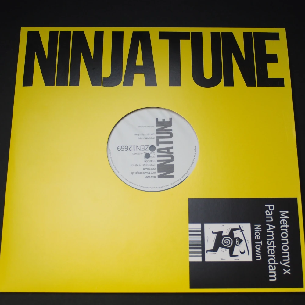 Front-facing view of die-cut sleeve featuring circular label artwork.