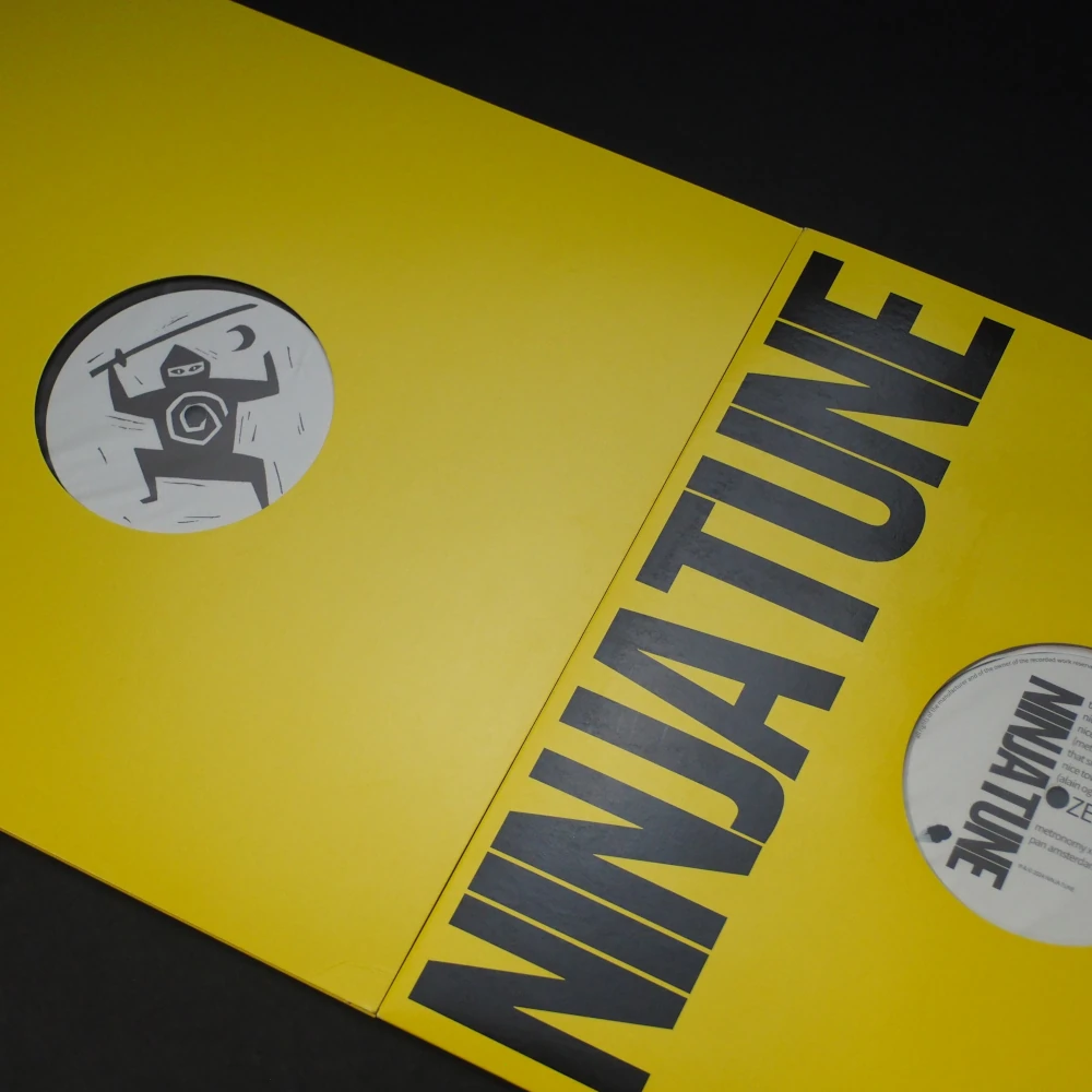 Full vinyl jacket with Ninja Tune logo and label artwork exposed through die-cut.