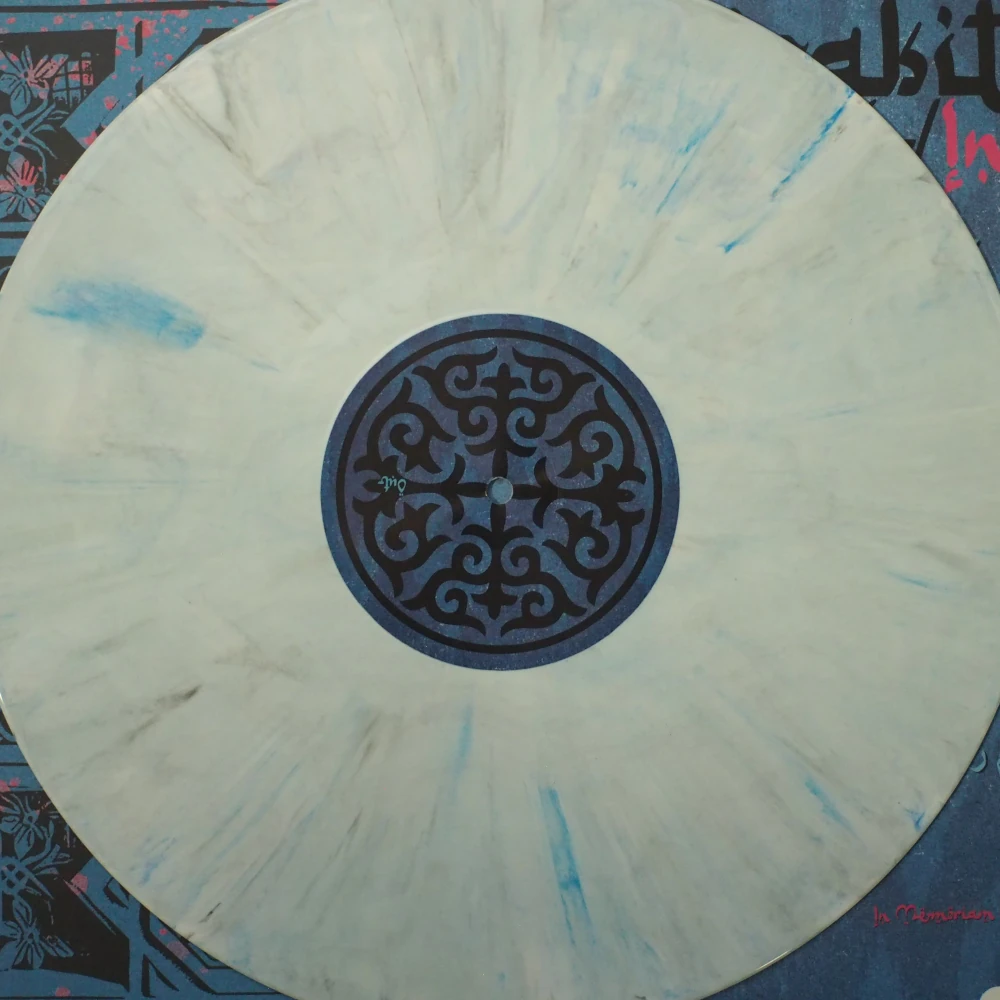 Close up of a white marble vinyl with blue stripes