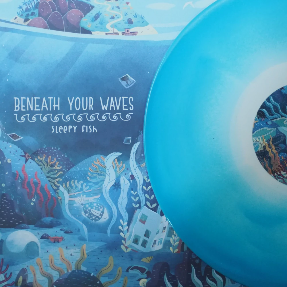 Beneath Your Waves LP front cover with sea life illustration and blue swirl vinyl.