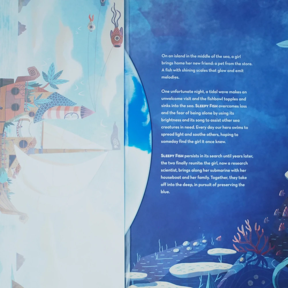 Gatefold jacket spread with printed lyrics and visible blue swirl vinyl.