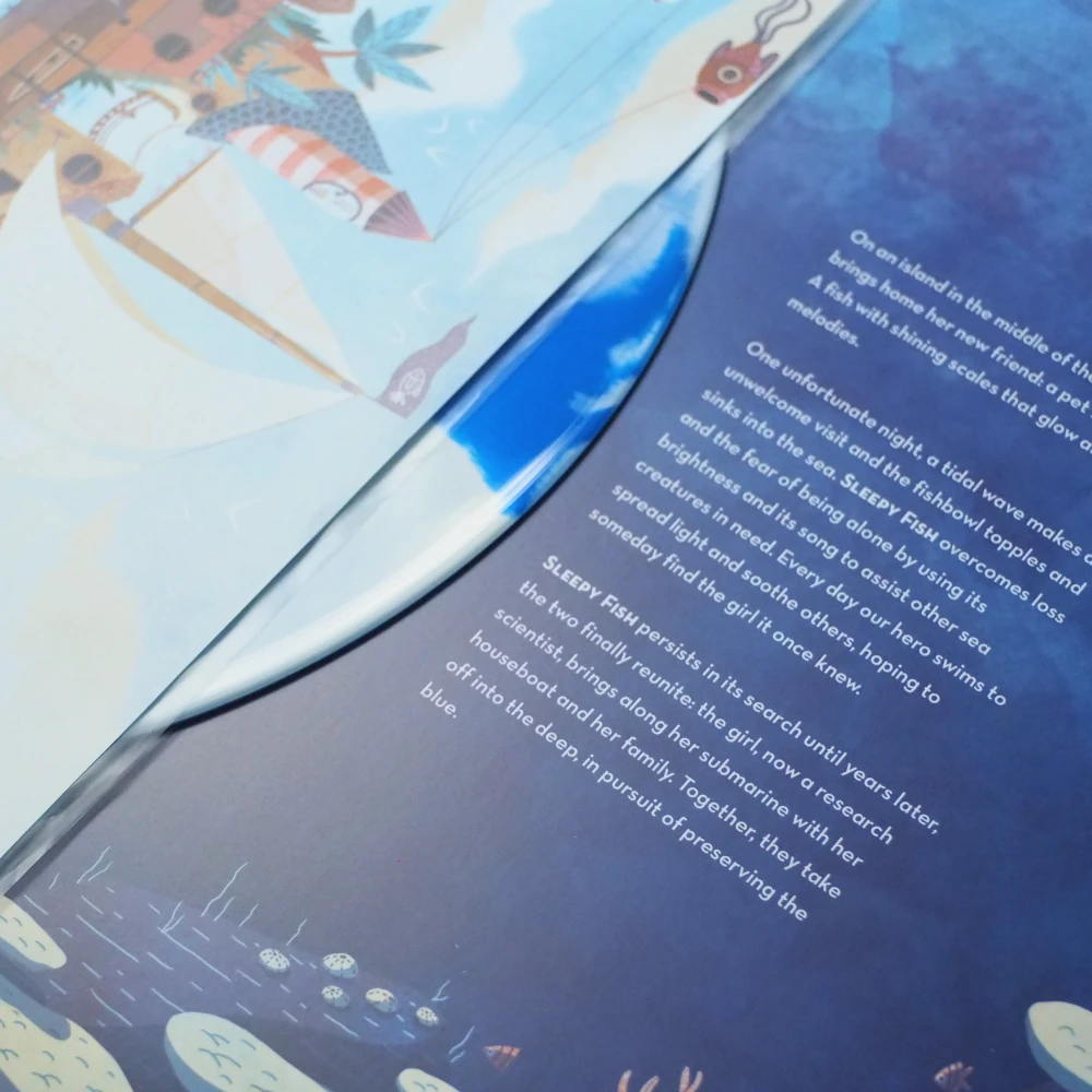 Blue and white swirl vinyl peeking from open gatefold sleeve with full-color artwork.