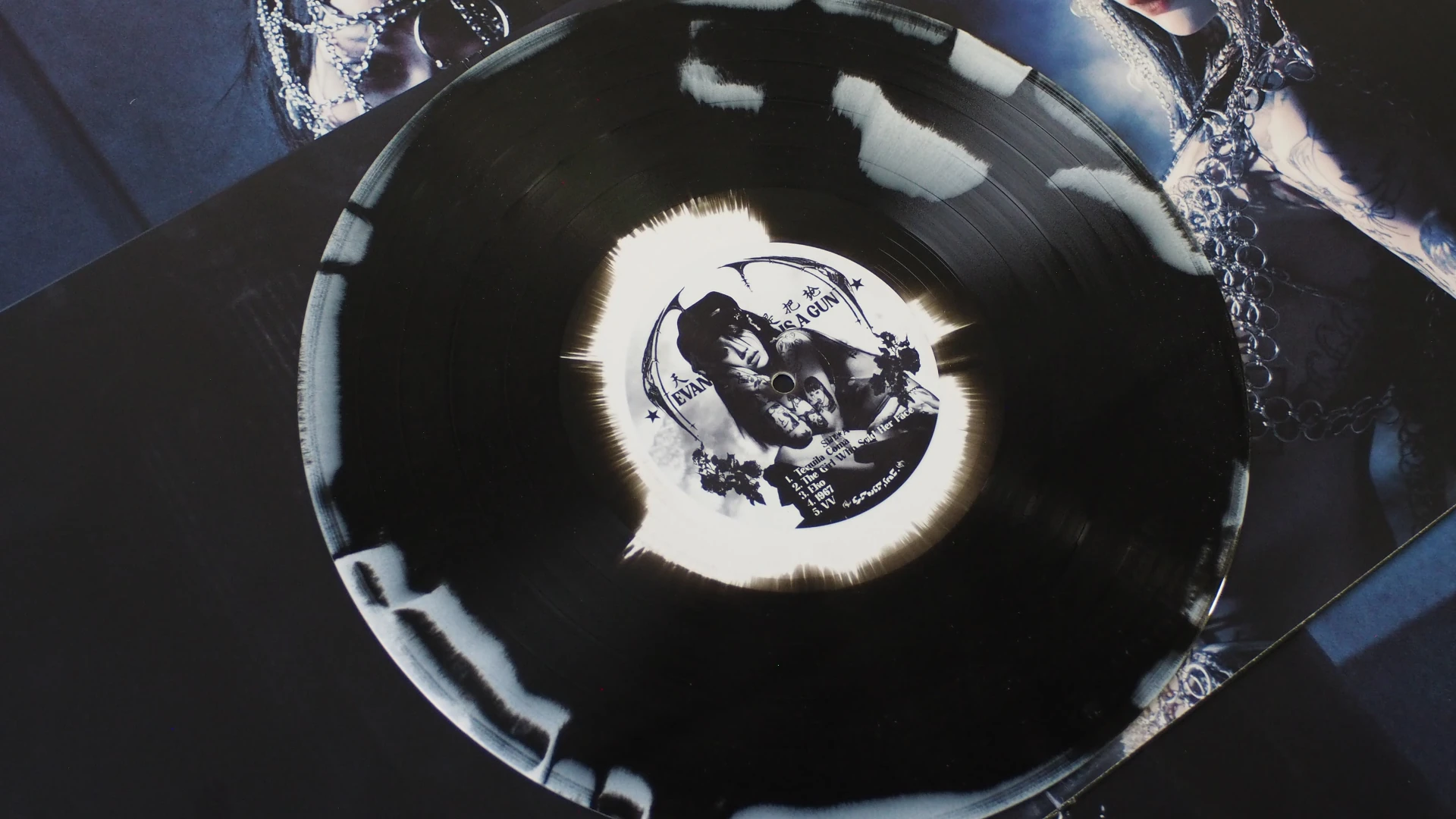 Black and white splatter vinyl of Yeule – Evangelic Girl Is A Gun.
