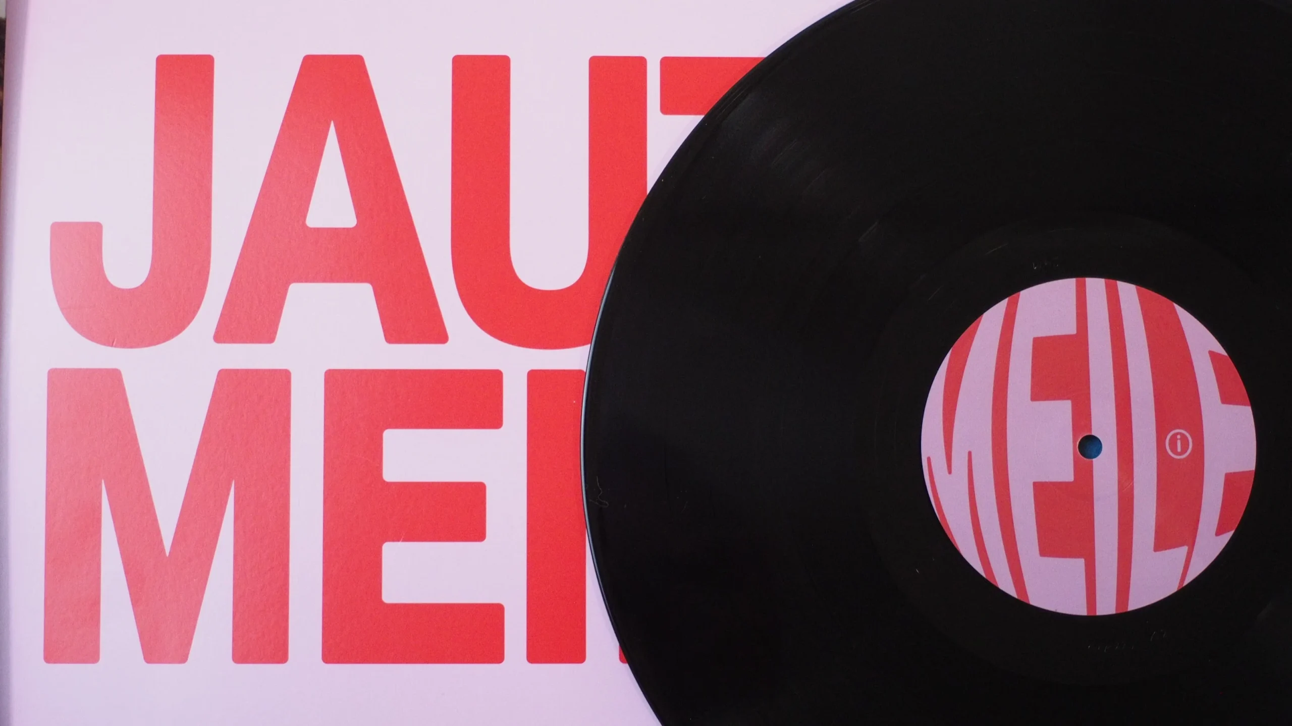 Jauti Meilė cover artwork with matching vinyl label design.