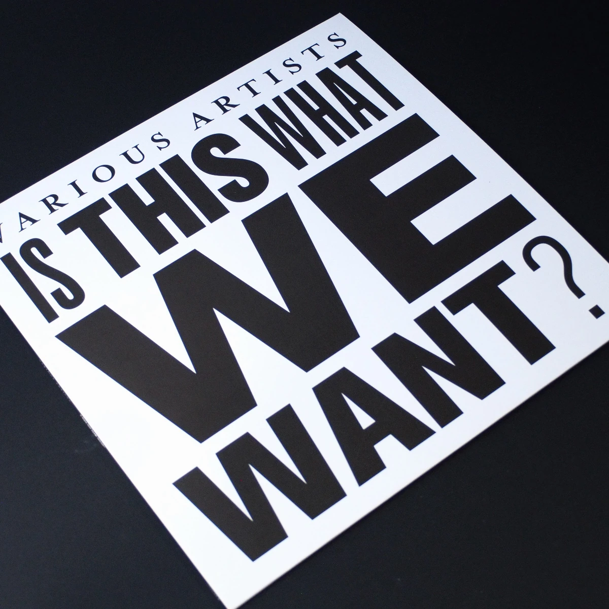 Full front cover artwork with oversized black text on white sleeve.