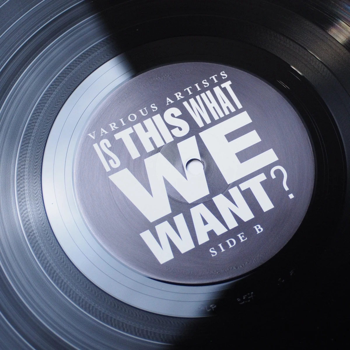 Close-up of Side B label with bold white-on-black text design.