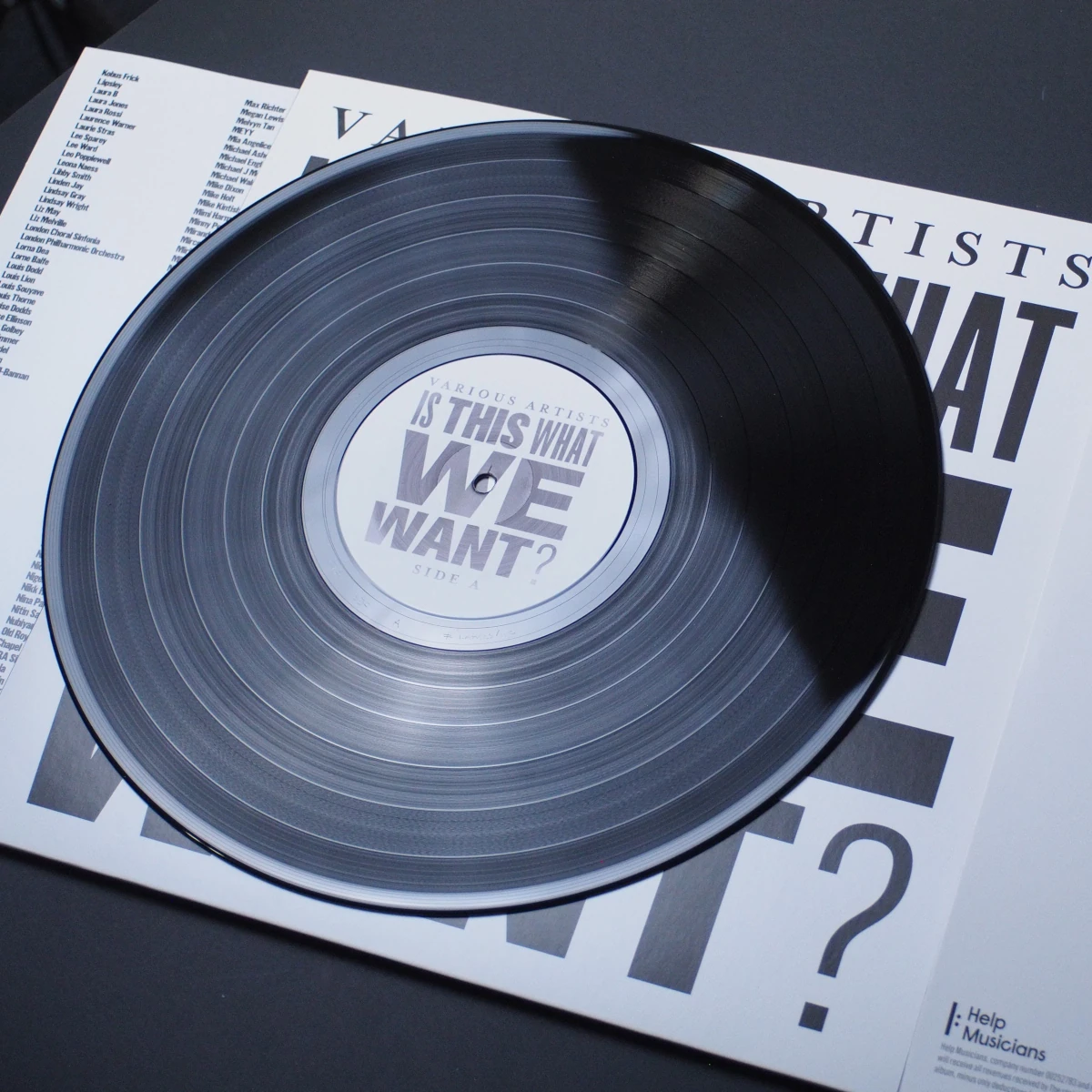 Vinyl lying on the opened sleeve, revealing the Side A label.