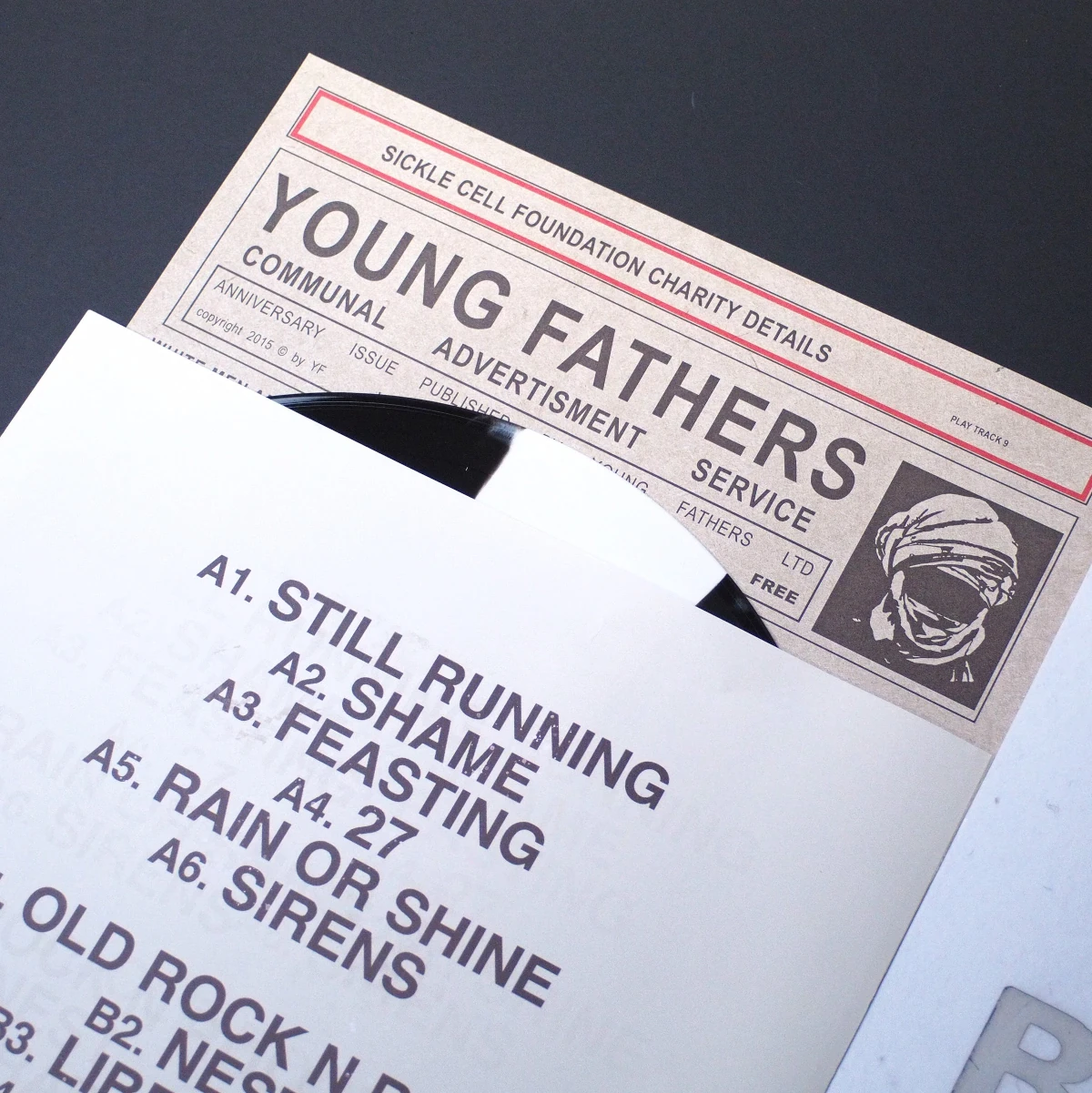 Tracklist insert and poster for Young Fathers release.